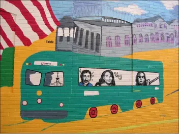  ?? KEVIN TUSTIN - MEDIANEWS GROUP ?? Todd Rundgren, far right, painted into an Upper Darby mural riding a trolley with Jim Croce and Tina Fey, two other Upper Darby stars. The mural was unveiled last month. On Tuesday, Rundgren was nominated for the Rock and Roll Hall of Fame, for the second time.