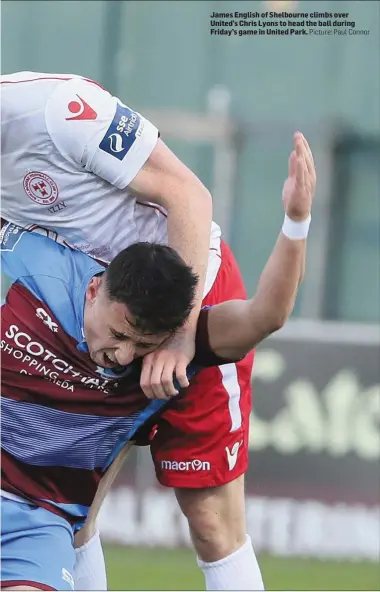  ??  ?? James English of Shelbourne climbs over United’s Chris Lyons to head the ball during Friday’s game in United Park. Picture: Paul Connor