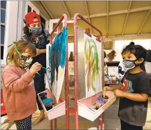  ?? IN TEACHER Carolyn Cole Los Angeles Times ?? Kirsten Hove’s class at Ladybug Childcare and Preschool in San Francisco in August, the everyday tools of learning included watercolor­s, brushes and protective masks.