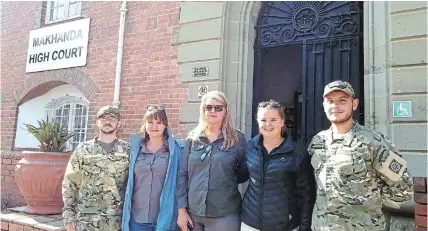  ?? Picture: SUE MACLENNAN ?? SAVE OUR RHINOS: Anti-poaching activists outside the Makhanda high court on Friday before judgment was delivered in the case of six men tried for conspiring to poach rhinos. The activists are, from left, Joseph Thomas (Lalibela Reserve Anti-Poaching Unit), Nikki Bolton (One Land Love It), Ayesha Cantor (owner, Kragga Kamma Game Park), Laura Bolton (One Land) and Jeandre van Dam (Lalibela APU).