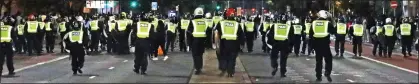  ??  ?? CRACKDOWN:
Police faced a barrage of bricks and bottles as they broke up an illegal rave in Finsbury Park, North London