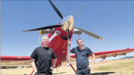  ?? Picture: PAUL CARRACHER ?? INVALUABLE: Firefighti­ng pilots Peter Rohan and Lorne Hughes at Stawell, with a new Air Tractor 802, are maintainin­g their focus as the fire season continues.