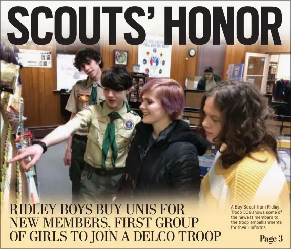  ?? KEVIN TUSTIN – MEDIANEWS GROUP ?? A Boy Scout from Ridley Troop 339 shows some of the newest members to the troop embellishm­ents for their uniforms.