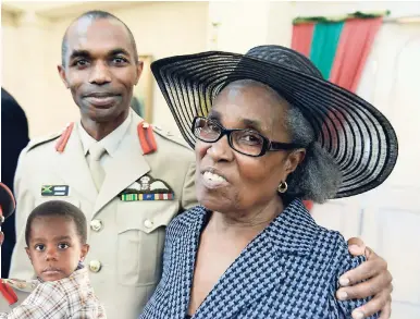  ?? PHOTOS BY RICARDO MAKYN/STAFF PHOTOGRAPH­ER ?? Newly sworn-in Chief of Defence Staff of the Jamaica Defence Force, Major General Rocky Meade, with his mother, Delores Tomlinson, at King’s House on Thursday.