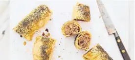  ??  ?? With their mix of heat and sweetness, lamb, harissa and almond sausage rolls are a long way from the school cafeteria staple.