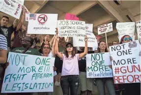  ?? NICOLE RAUCHEISEN/USA TODAY NETWORK ?? Protesters demand gun control at a rally Feb. 17 in front of the federal courthouse in Fort Lauderdale.