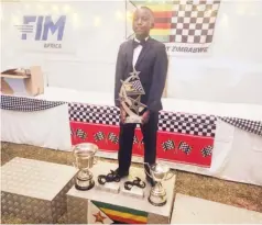 ?? ?? CREME DE LA CREME . . . Young motocross rider Victor Nyamupfuku­dza enjoys his moment on the podium after scooping three awards during the Motorsport Zimbabwe Awards Function Night for 2023 at Highlands Sports Club in Harare on Saturday night