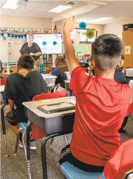  ?? JARROD VALLIERE U-T ?? Rya Hege teaches her fourth-grade class at T.H.E Leadership Academy in October in Vista. Getting schools open has been a major concern during the pandemic.