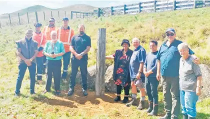  ?? ?? Mana whenua, landowners and stakeholde­r representa­tives at the installati­on of the first Taiea te Taiao ecological corridor project marker at Maungataut­ari.