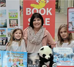  ?? Picture: FAITH QINGA ?? WORLD OF ADVENTURES: Author Roz Potgieter alongside her granddaugh­ters, Anastasia, left, and Gabriella at her book launch hosted by Bargain Books in Port Alfed recently