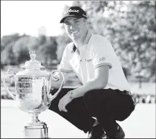  ?? ?? Justin Thomas with the trophy