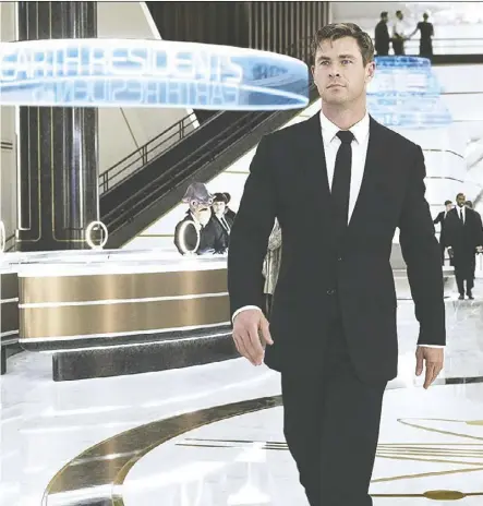  ??  ?? Chris Hemsworth stars in the latest incarnatio­n of Men in Black, which he seemed to enjoy filming — mostly because of the souped-up cars.