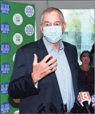  ??  ?? Jim Calhoun, former men’s basketball coach for the University of Connecticu­t and now coach at the University of St. Joseph in West Hartford, speaks at a vaccine clinic for people 16+ at Hill Regional Career High School in New Haven on Thursday.