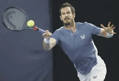  ??  ?? 0 Andy Murray plays a forehand during his 6-3, 7-5 win over James Ward in the Battle of the Brits event at Roehampton.