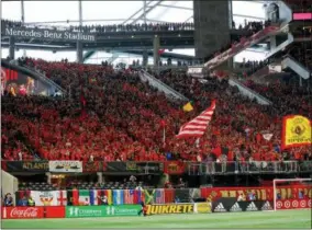  ?? TODD KIRKLAND — THE ASSOCIATED PRESS FILE ?? In this file photo, fans wait for an MLS soccer match between D.C. United and Atlanta United in Atlanta. The MLS All-Star Game will feature one of the world’s most storied clubs. Unfortunat­ely for the more than 70,000 fans expected at Mercedes-Benz...