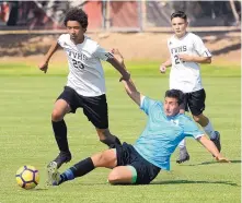  ?? GREG SORBER/JOURNAL ?? Volcano Vista’s Alex Dixon, No. 23, and Cleveland’s Sollin Casey, No. 14, battle for the ball as they are followed by Volcano Vista’s Elijah Baca during the UNM Lobo Men’s Soccer High School Summer Series at Robertson Field on July 10.