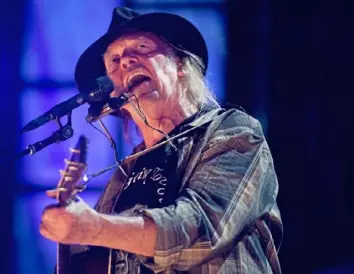  ?? Steph Chambers/Post-Gazette ?? Neil Young performs during Farm Aid in 2017 at KeyBank Pavilion in Burgettsto­wn. The singer is suing President Donald Trump’s campaign for using his music at a rally earlier this year.
