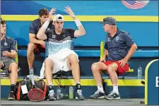  ?? TREVOR COLLENS/AP PHOTO ?? John Isner of the United States reacts as he talks to U.S. Captain David Macpherson in a points break during his match against Russia’s Daniil Medvedev on Sunday at the ATP Cup in Perth, Australia.