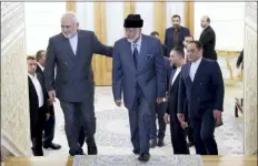  ?? EBRAHIM NOROOZI — THE ASSOCIATED PRESS ?? Iranian Foreign Minister Mohammad Javad Zarif, left, welcomes his Omani counterpar­t Yousuf bin Alawi for their meeting, in Tehran, Iran, Saturday.