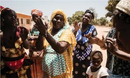  ?? Photograph: Ruth McDowall/ Sightsaver­s ?? Kangenlen Kato, a song and dance group raising awareness of trachoma in Mariama Kunda, the Gambia.