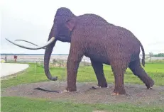  ?? CHELSEY LEWIS/ MILWAUKEE JOURNAL SENTINEL ?? A wooly mammoth sculpture greets visitors at the Horicon Marsh Education and Visitor Center on Highway 28 north of Horicon.