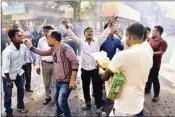  ??  ?? Activists of Assam Jatiya Yuba Chatra Parishad distribute sweet items and burn fire-crackers as they celebrate after the Citizenshi­p Amendment Bill could not be passed in the Rajya Sabha, in Guwahati, Wednesday