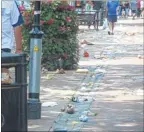  ??  ?? Rubbish was strewn across the high street in Ashford on Sunday, July 7