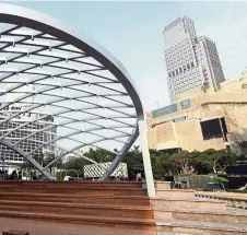  ??  ?? Salisbury Garden also features this trellised arch over a wooden performanc­e platform, with steps leading to the harbourfro­nt. — Photos: China Daily/ANN