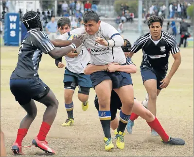  ?? Picture FREDLIN ADRIAAN ?? MY BALL: DF Malherbe’s Ruben du Toit dives with ball against Bergvliet during the 10th Westering High Co-Ed Festival at the weekend