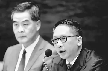  ??  ?? File photo shows Hong Kong Chief Executive Leung Chun-ying (L) and Secretary for Justice Rimsky Yuen Kwok-keung at a news conference in Hong Kong. — Reuters photo