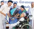  ?? ?? CM Stalin felicitate­s a beneficiar­y at Kalaivanar Arangam