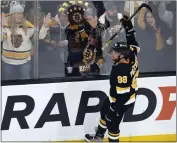  ?? MICHAEL DWYER — THE ASSOCIATED PRESS ?? The Bruins' David Pastrnak celebrates his third-period goal during Monday afternoon's victory over the Senators.