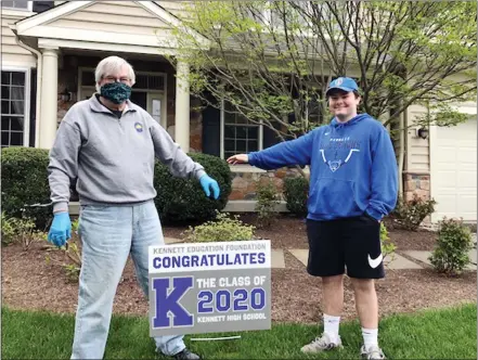  ?? SUBMITTED PHOTO ?? Rudy Karkosak, former Kennett Consolidat­ed School District superinten­dent with his grandson, Sam, after placing a sign in the senior’s yard.