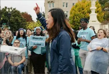  ?? Shuran Huang/The New York Times ?? Activists rally outside the Supreme Court in Washington in October as justices hear oral arguments in the affirmativ­e action cases involving Harvard and the University of North Carolina at Chapel Hill.