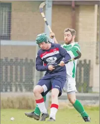  ?? Photograph: Donald Cameron. ?? David Hill from Oban Celtic shields the ball from Beauly’s Sean Stewart during their National Division game at Braeview Park .