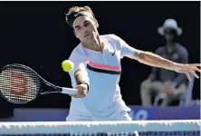  ?? Dita Alangkara / Associated Press ?? Roger Federer was looking to defend his Australian Open title in Melbourne. He’ll make his Bay Area debut in March.