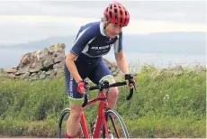  ??  ?? On her bike Aileen Fisher battles the wind on the Isle of Cumbrae