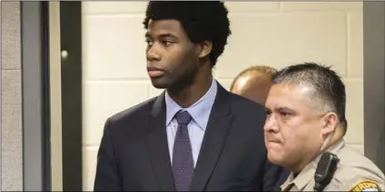  ??  ?? In this July 11, file photo, Meechaiel Criner, accused of killing University of Texas student Haruka Weiser in April 2016, is escorted into a courtroom in Austin, Texas. A jury on Friday, found Criner guilty of capital murder. RICARDO BRAZZIELL/AUSTIN...