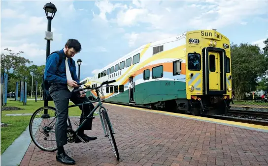  ??  ?? TRAINING WHEELS: Altamonte Springs has solved the last-mile problem for commuters by subsidizin­g Uber rides to and from Sunrail stations.