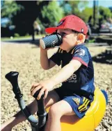  ?? PHOTO: MELANIE ROWCROFT ?? Drinks break . . . Harry Rowcroft (3) drinks a hot chocolate at the Wanaka playground on January 9.