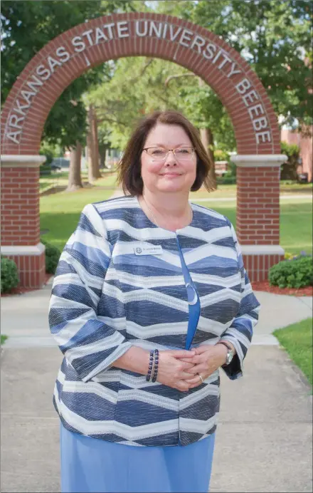  ?? MARK BUFFALO/THREE RIVERS EDITION ?? Jennifer Methvin, the new chancellor at Arkansas State University-Beebe, stands in the middle of campus at the start of her second week at the White County community college July 9. She spent the previous four years as president of Crowder College in Neosho, Mo. Methvin, a native of Holly Grove, started her teaching career at ASU-Beebe in 1991.