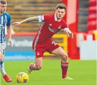  ??  ?? Dons midfielder Matty Kennedy in action