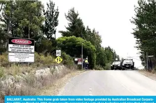  ?? ?? BALLARAT, Australia: This frame grab taken from video footage provided by Australian Broadcast Corporatio­n (ABC) on March 14, 2024 shows security personnel at a gate of an Australian gold mine that collapsed on March 13, 2024. — AFP