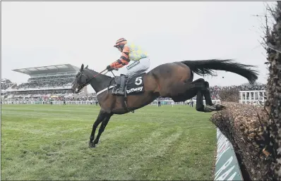  ??  ?? ALMOST THERE: Might Bite, ridden by Nico de Boinville, jumps the last on its way to winning the Betway Bowl Chase.