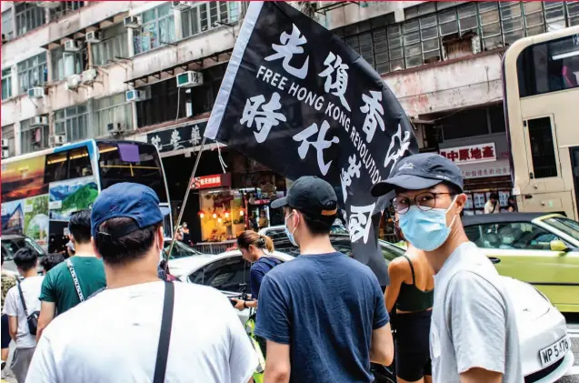  ??  ?? NOT LYING DOWN Hong Kong protesters take to the streets July 1, the day the new national security law took effect.