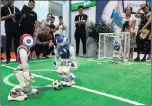  ??  ?? Robot footballer­s are a popular drawcard.