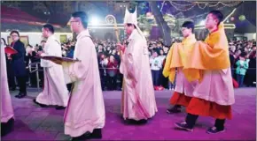  ?? GREG BAKER/AFP ?? Bishop Li Shan performing ceremonies during a mass on Holy Saturday, part of Easter celebratio­ns at Beijing’s government sanctioned South Cathedral, on March 31. Bibles have been pulled from online retailers in China.