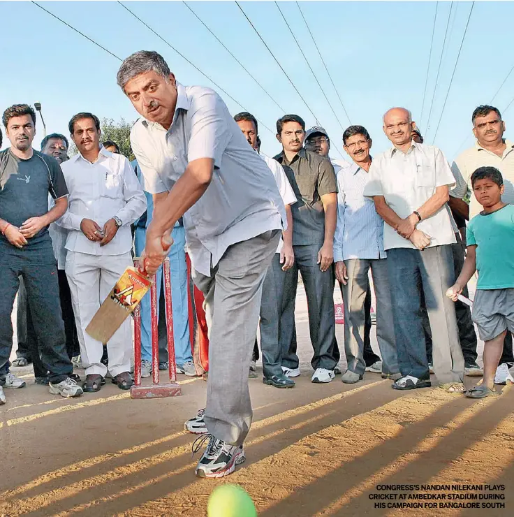  ??  ?? CONGRESS’S NANDAN NILEKANI PLAYS CRICKETATA­MBEDKAR STADIUM DURING
HIS CAMPAIGN FOR BANGALORE SOUTH