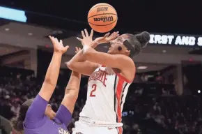  ?? BARBARA J. PERENIC/COLUMBUS DISPATCH ?? Ohio State’s Taylor Thierry battles James Madison’s Jamia Hazell.