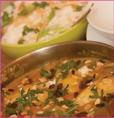 ??  ?? Delicious and creamy fruity chicken curry with toasted almonds.